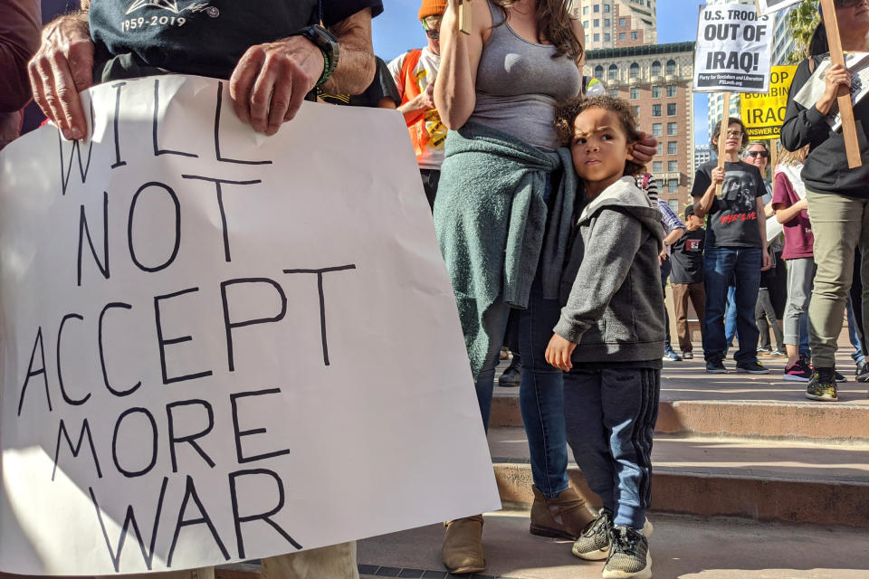 Activists gather in Pershing Square in downtown Los Angeles on Saturday, Jan. 4, 2020, to protest recent U.S. military actions in Iraq. A top Iranian general and Iraqi militiamen were killed in a U.S. airstrike that sharply escalated tensions across the region. (AP Photo/Damian Dovarganes)