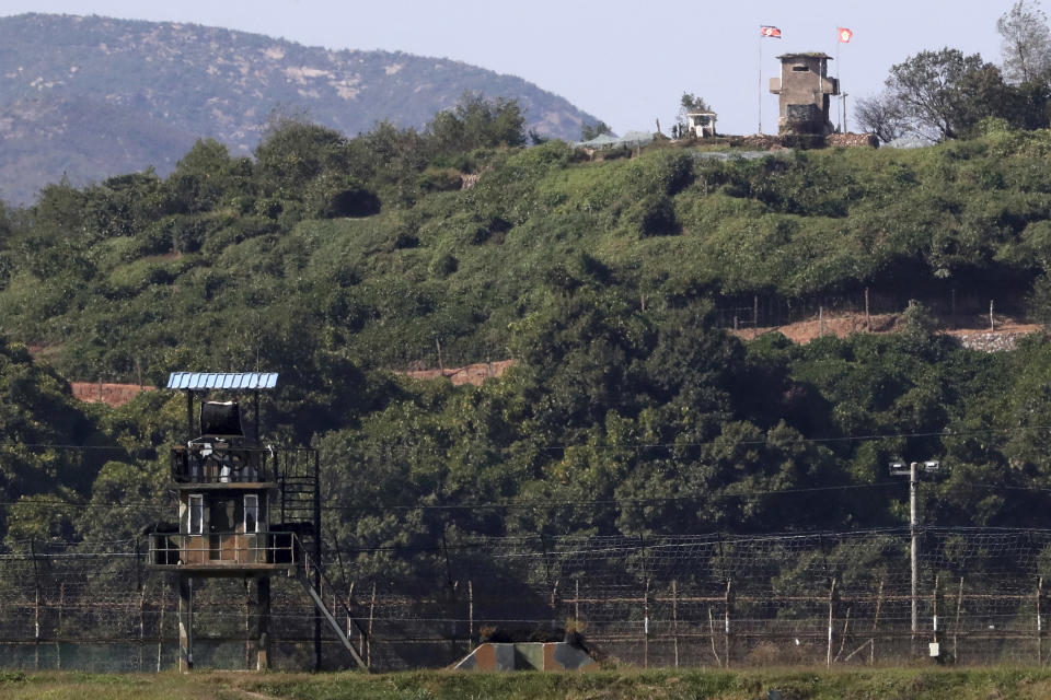 In this on Sunday, Sept. 30, 2018 photo, military guard posts of North Korea, right top, and South Korea, left bottom, are seen in Paju, at the border with North Korea, South Korea. Seoul on Monday, Oct. 1, 2018, says South Korea has begun clearing mines from two sites inside the heavily fortified border with North Korea under a package of tension-reduction deal between the rivals. (Kim Do-hoon/Yonhap via AP)