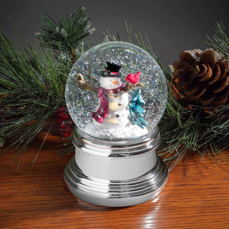 the snowglobe with falling snow