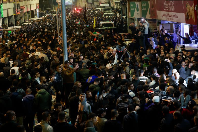 Mourners attend the funeral of Palestinians killed during an Israeli raid, in Jenin
