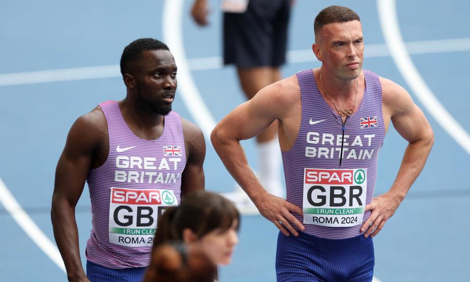 <span>Britain’s Romell Glave and Richard Kilty after finishing last in the men’s 4x100m relay heats.</span><span>Photograph: Michael Steele/Getty Images</span>