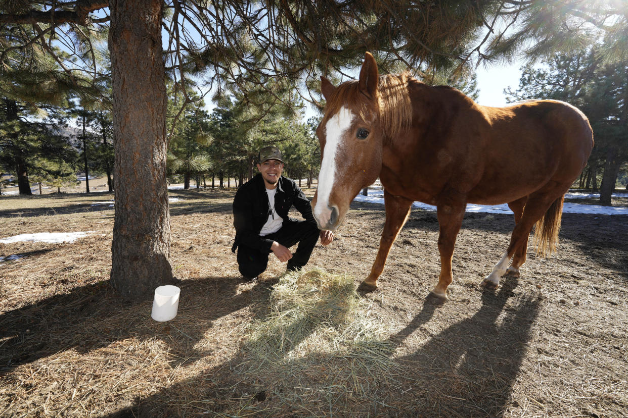 Jason Lopez, a proponent of a Colorado general election ballot measure to decriminalize psychedelic mushrooms, is shown on his family's property Sunday, Oct. 30, 2022, near Morrison, Colo. If the measure passes next Tuesday, Colorado would become the second state in the union—behind only Oregon—to decriminalize the psychedelic mushrooms. (AP Photo/David Zalubowski)