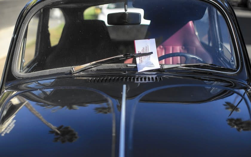 A car off Hawthorn Avenue in Hollywood is ticketed on street-sweeping day.