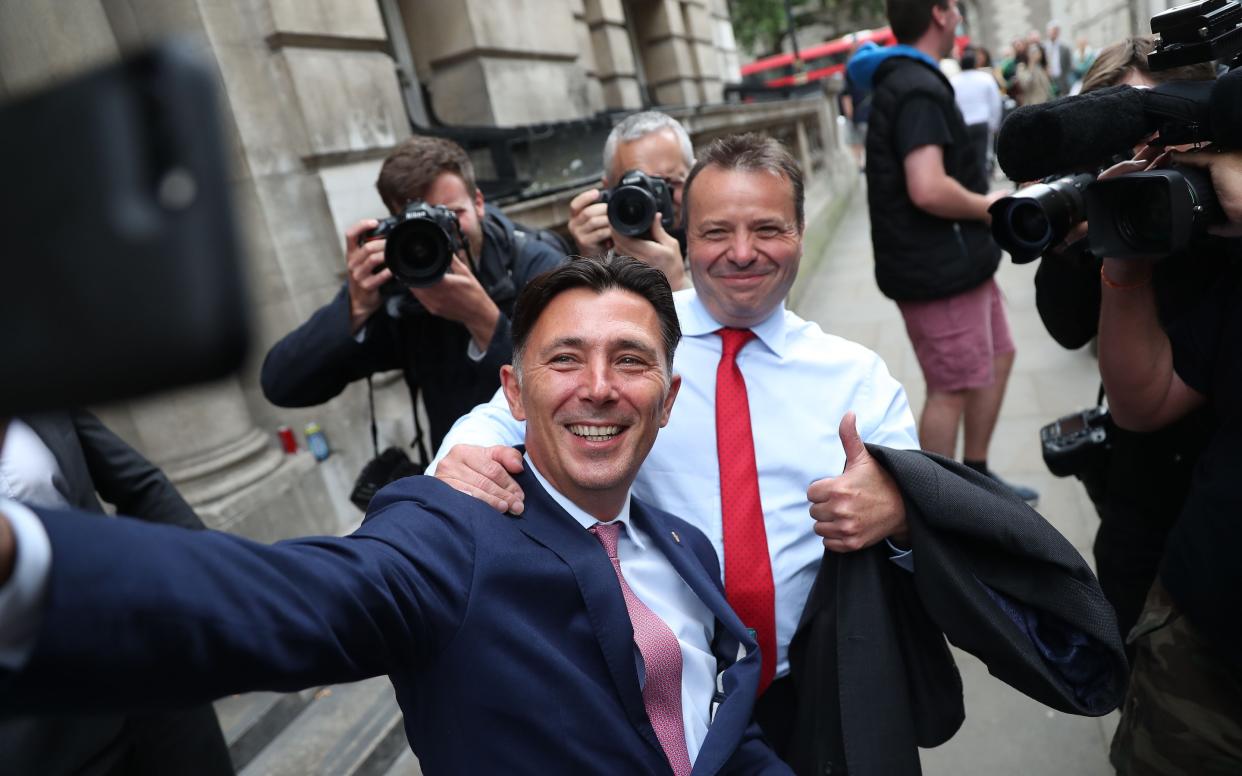 Andy Wigmore, left, and Arron Banks -  DANIEL LEAL-OLIVAS/ AFP or licensors 