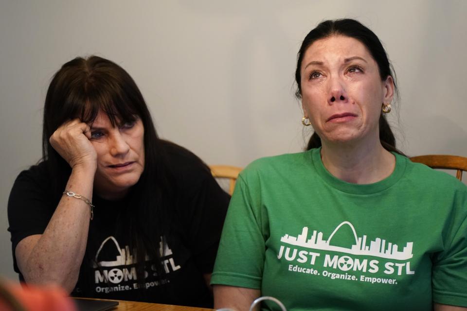 FILE - Karen Nickel, left, and Dawn Chapman, co-founders of Just Moms STL, a group created to bring attention to nuclear contamination found in the metropolitan area, pause while sharing stories Friday, April 7, 2023, in Maryland Heights, Mo. (AP Photo/Jeff Roberson, File)