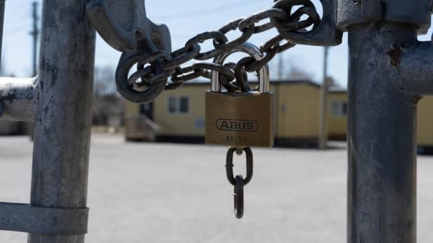 A locked gate outside St. Leonard Catholic School in Manotick, Ont. The province will keep all schools closed indefinitely after spring break, citing the threat of rampant community spread. 