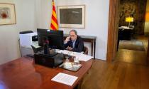 Spain's Catalonia regional head of government Quim Torra talks on his mobile phone during an interview with Reuters from his government palace in Barcelona