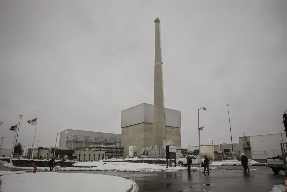 FILE - This Feb. 25, 2010, file photo shows the former Oyster Creek nuclear plant in Lacey Township, N.J. The plant is one of two former power plants that will connect a large offshore wind energy project planned off the coast of New Jersey. (AP Photo/Mel Evans, File)