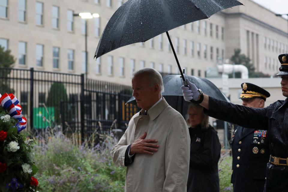 President Joe Biden attends a wreath-laying ceremony to honour victims of 9/11 attacks at the Pentagon on 11 September (Reuters)