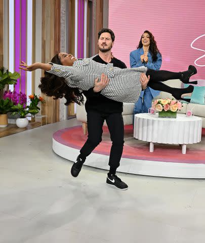 <p>ANDREW WERNER/SHERRI/DEBMAR-MERCURY</p> Val Chmerkovskiy lifts up his former DWTS partner Sherri Shepherd on her show