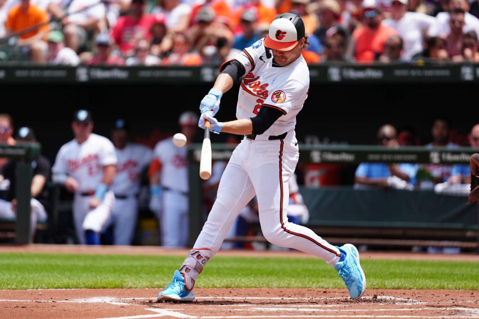 Jun 16, 2024; Baltimore, Maryland, USA; Baltimore Orioles shortstop Gunnar Henderson (2) hits a home run against the Philadelphia Phillies during the first inning at Oriole Park at Camden Yards. Mandatory Credit: Gregory Fisher-USA TODAY Sports