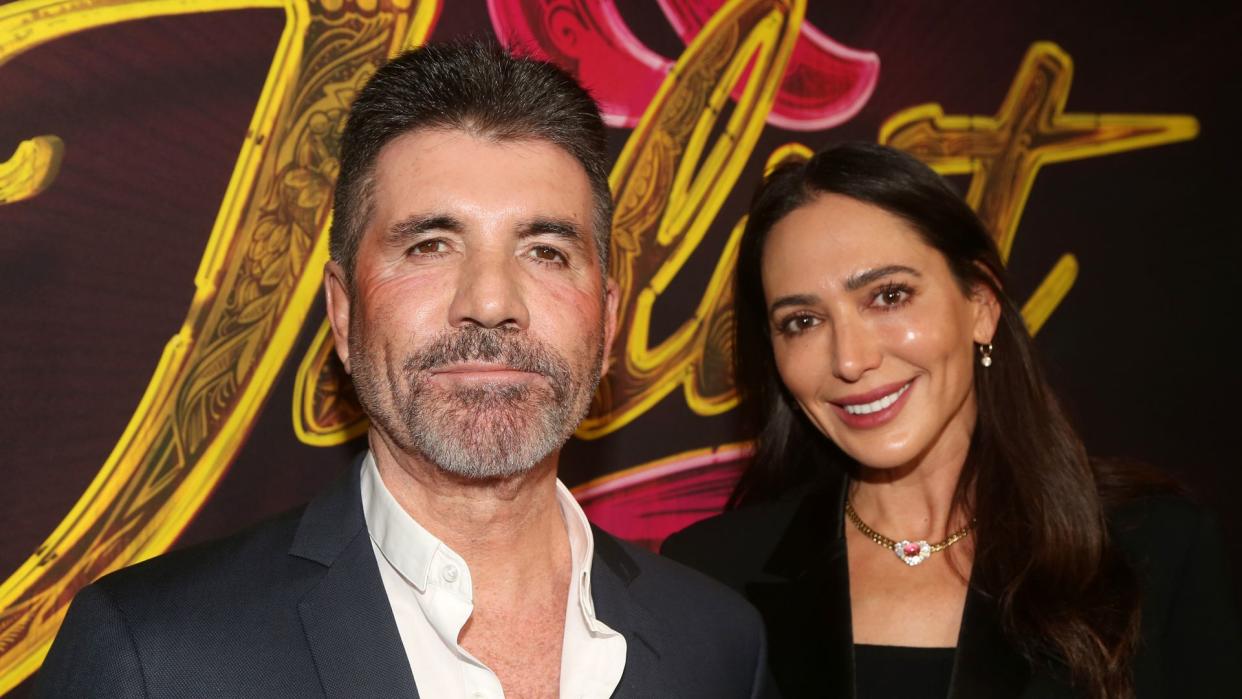 Simon Cowell and Lauren Silverman pose at the opening night of the new musical 