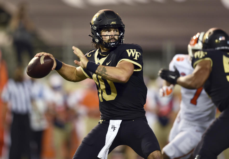 Wake Forest quarterback Sam Hartman drops back to throw during an NCAA college football game against Clemson, Saturday, Sept. 12, 2020, in Winston-Salem, N.C. (Walt Unks/The Winston-Salem Journal via AP)