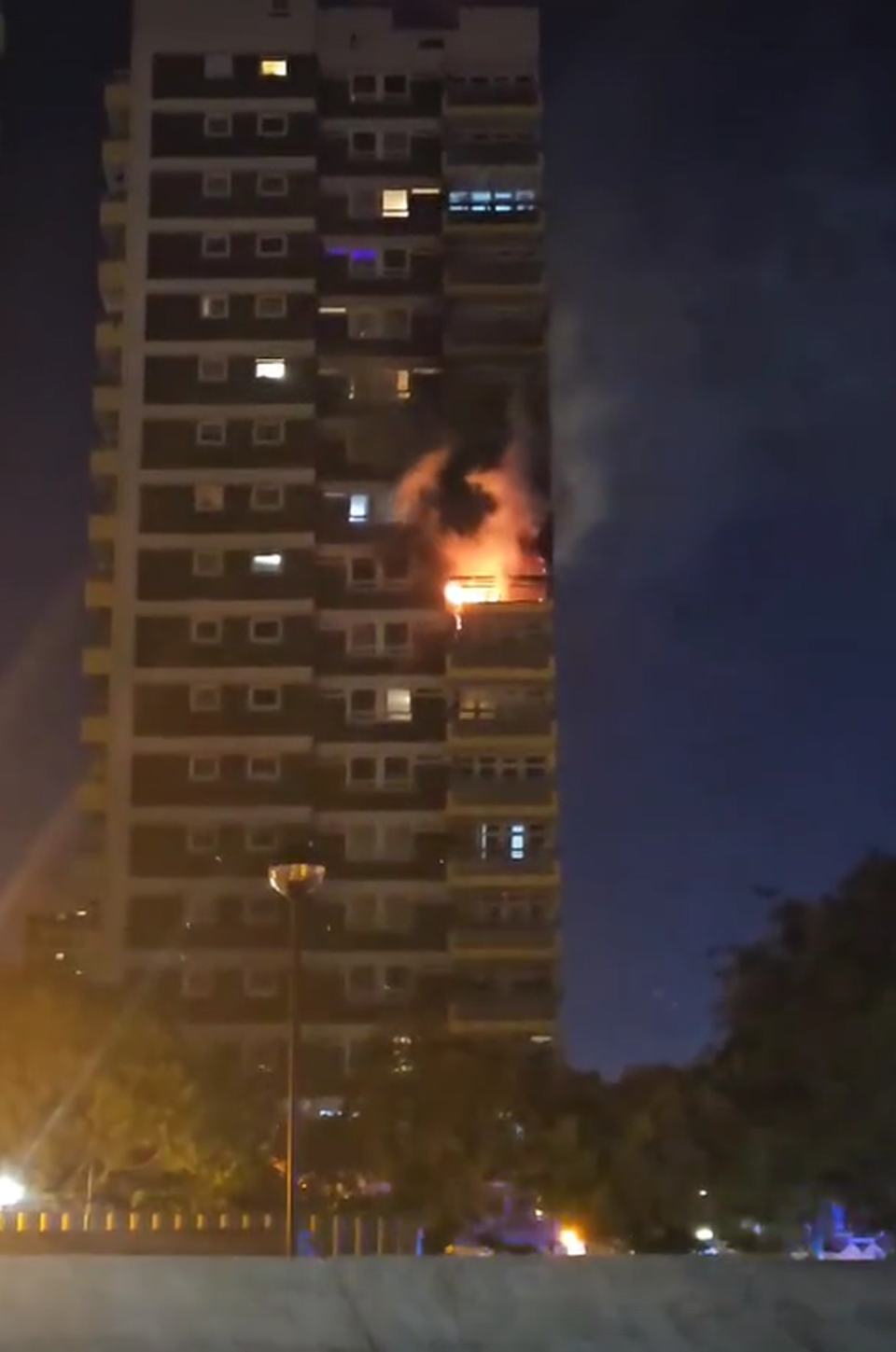 The fire could be seen burning through the building while resident's lights were on in the flats above (Fitor Dauti)