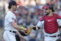 Cleveland Guardians starting pitcher Shane Bieber, left, is greeted by catcher Mike Zunino as he walks off the field during the second inning of the team's baseball game against the St. Louis Cardinals, Friday, May 26, 2023, in Cleveland. (AP Photo/Sue Ogrocki)