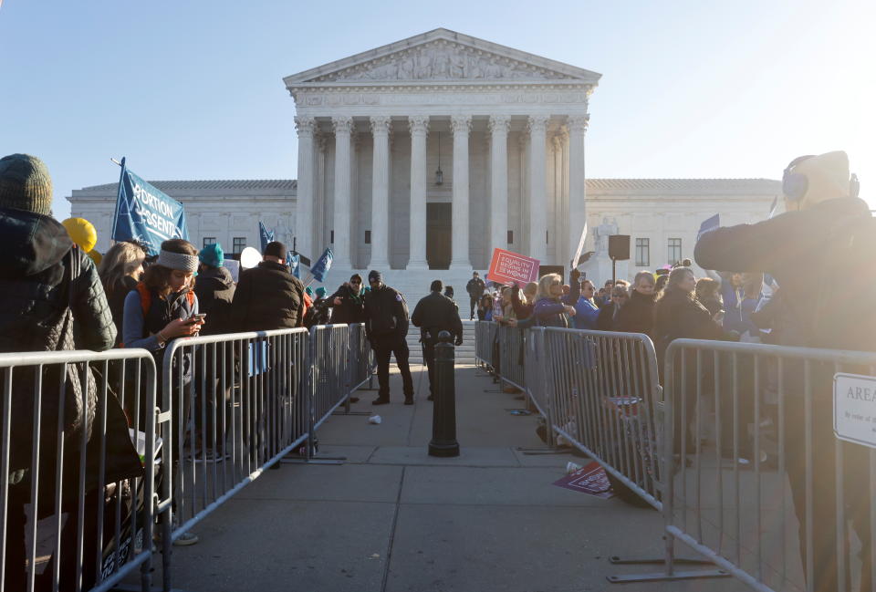 Supreme Court Police officers guard a barrier between anti-abortion and pro-abortion rights protesters outside the court building, ahead of arguments in the Mississippi abortion rights case Dobbs v. Jackson Women's Health, in Washington, U.S., December 1, 2021. REUTERS/Jonathan Ernst