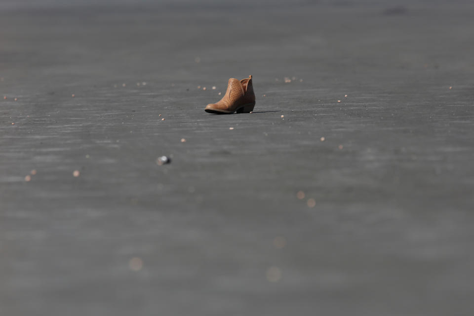 <p>A boot is pictured in the parking lot near the site of the Route 91 music festival mass shooting in Las Vegas, Nev., Oct. 5, 2017. (Photo: Chris Wattie/Reuters) </p>