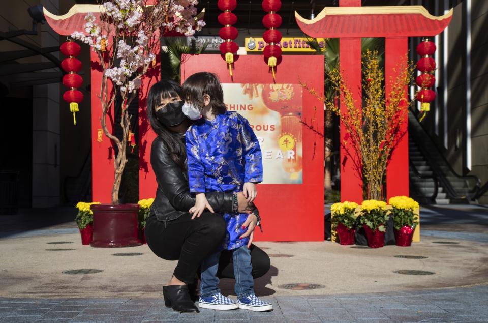 Kat Nguyen-De Angelis with her son Dominic, 4, at the Union Market in Tustin