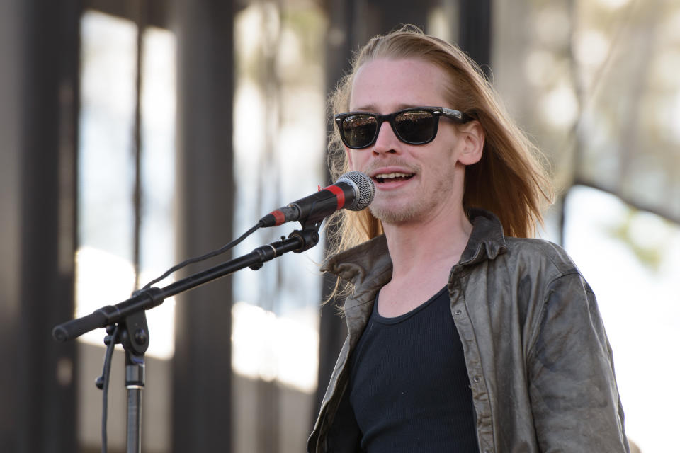 CHICAGO, IL - SEPTEMBER 13:  Macaulay Culkin of The Pizza Underground performs on stage at Riot Fest Chicago 2014 at Humboldt Park on September 13, 2014 in Chicago, United States.  (Photo by Daniel Boczarski/Redferns via Getty Images)