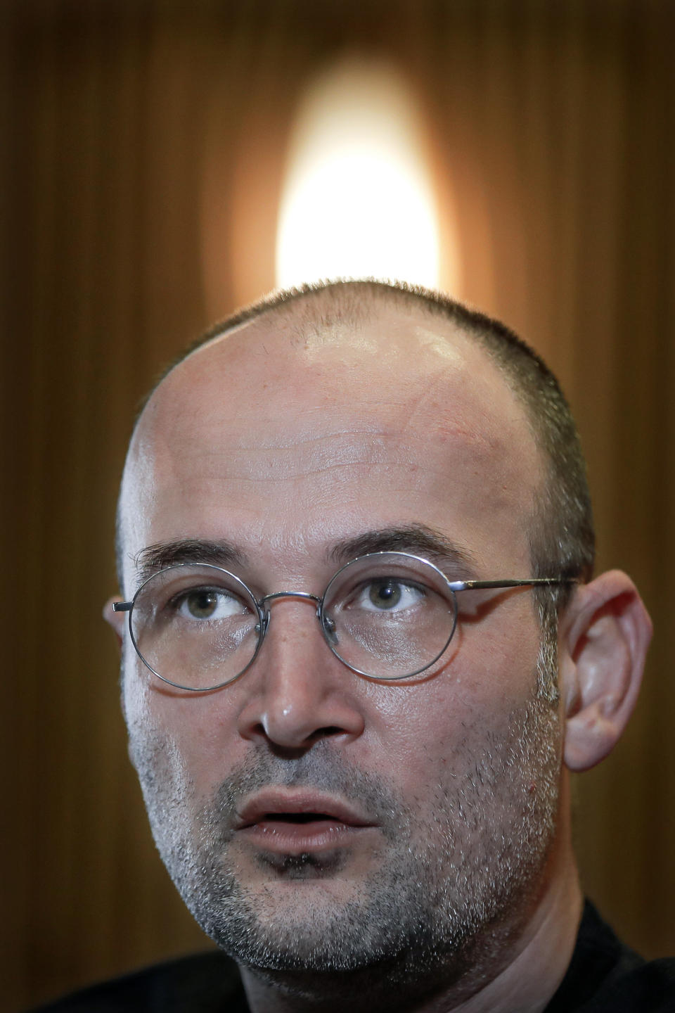 Romanian director Alexander Nanau, speaks during an interview with the Associated Press at the Elvire Popesco cinema in Bucharest, Romania, Monday, April 12, 2021. The Oscar-nominated Romanian documentary film “Collective” follows a group of journalists delving into the state of health care in the eastern European country in the wake of a deadly 2015 nightclub fire that left dozens of burned victims in need of complex treatment. What they revealed was decades of deep-rooted corruption, a heavily politicized system scarily lacking in care. (AP Photo/Vadim Ghirda)