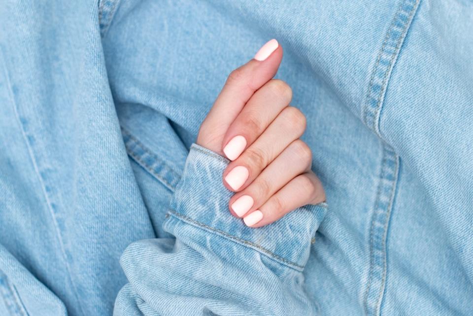 how to fix a broken nail, mainured hand on background