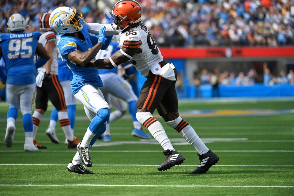 Cleveland Browns tight end David Njoku (85) blocks on Los Angeles Chargers safety Nasir Adderley (24) during the first half of an NFL football game Sunday, Oct. 10, 2021, in Inglewood, Calif. (AP Photo/Kevork Djansezian)