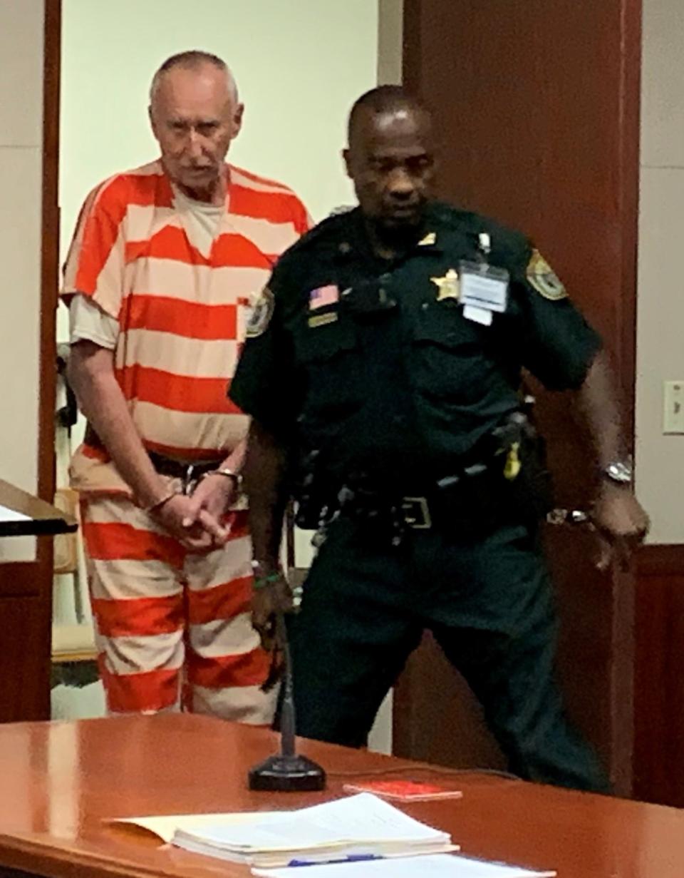 Brian Burkeen, former assistant fire chief for Indian River County, left, enters Circuit Judge Victoria Griffin's courtroom Tuesday Jan. 23, 2024, for an evidentiary hearing to determine whether his sentencing counsel was ineffective. He is escorted by Deputy Al Rosemond.