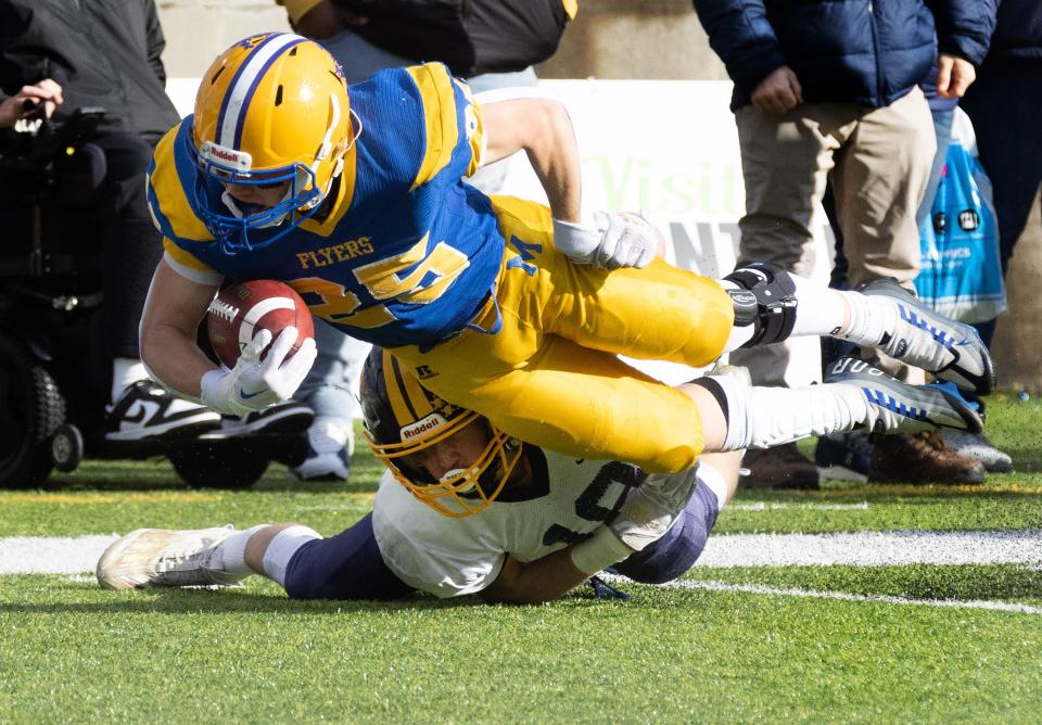 Marion Local’s Kyle Otte is brought down by Kirtland’s Will Beers short of the goal line, setting up Marion’s first score during the second quarter of the Division VI state final, Saturday, Dec. 3, 2022, at Tom Benson Hall of Fame Stadium.