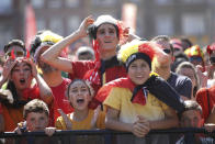 <p>Belgium soccer fans react as they watch a 2018 World Cup soccer match between Belgium and England on a giant screen in Jette, Belgium, Saturday, July 14, 2018. The match will determine third and fourth place. (AP Photo/Olivier Matthys) </p>