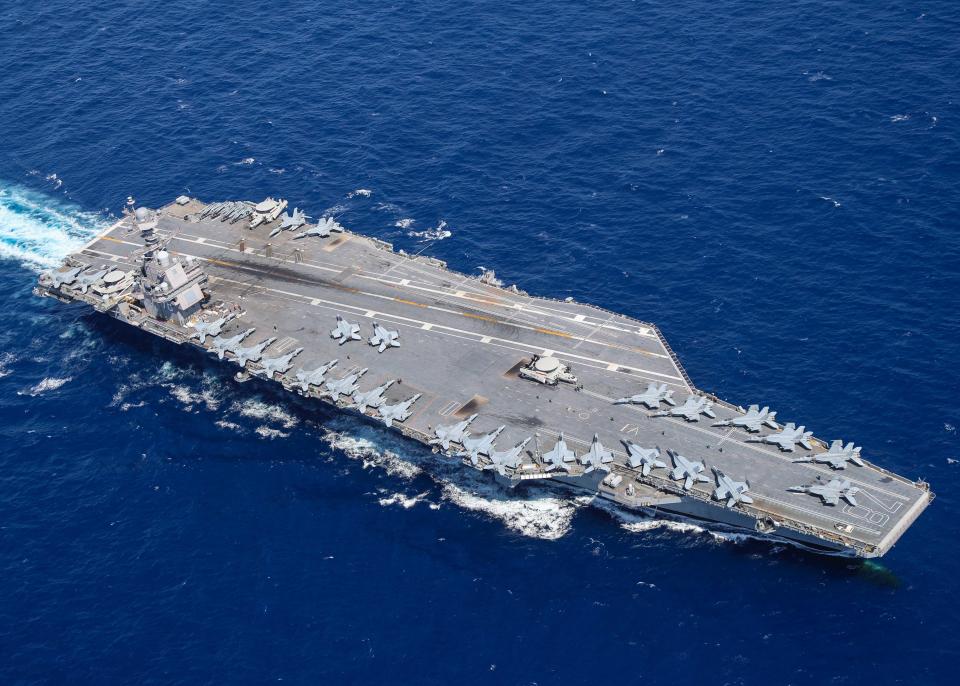 Aircraft attached to Carrier Air Wing (CVW) 8 sit on USS Gerald R. Ford's (CVN 78) flight deck as the ship steams through the Atlantic Ocean, April 13, 2022.