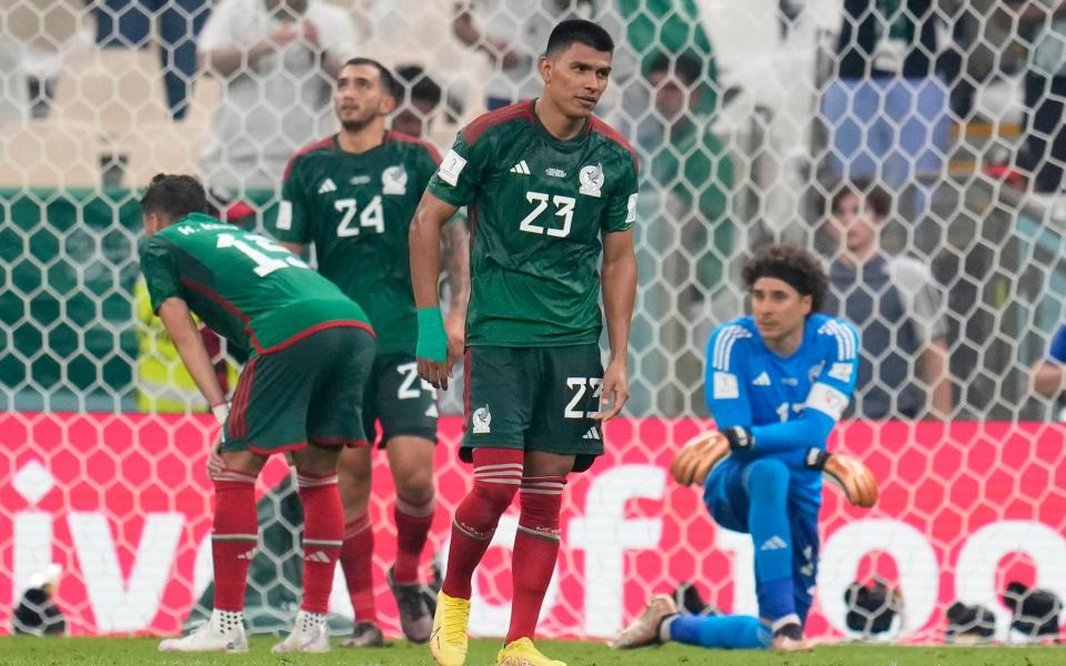 Mexico's Jesus Gallardo, center, reacts after Saudi Arabia scored a goal during the World Cup group C soccer match between Saudi Arabia and Mexico, at the Lusail Stadium - Ricardo Mazalan/AP