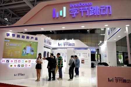 FILE PHOTO: People are seen at the Bytedance Technology booth at the Digital China exhibition in Fuzhou, Fujian