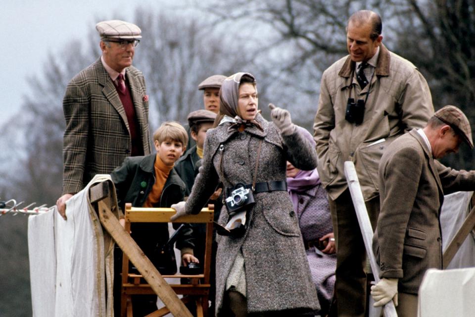 The Duke of Beaufort, Prince Edward, Viscount Linley, The Queen and Prince Philip watch cross-country from a farmcart at the Badminton Horse Trials, 1973.PA