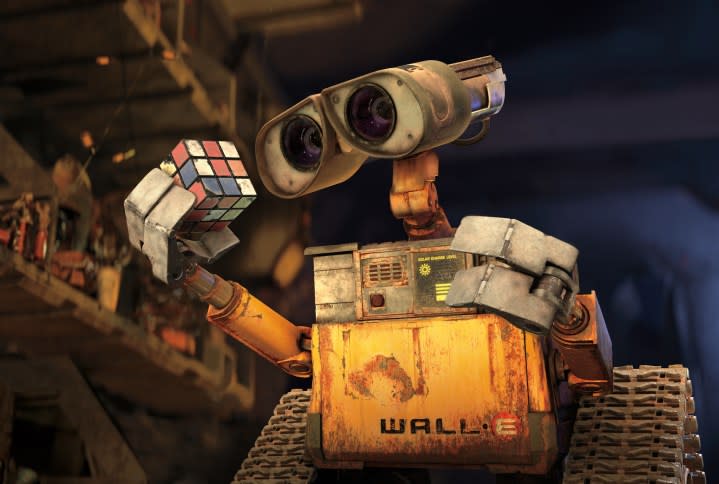 Wall-E looks at a Rubik's cube in Wall-E.