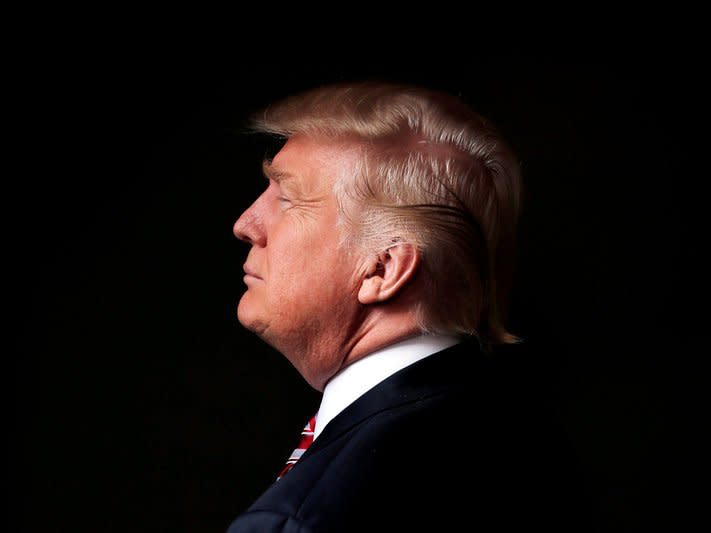 FILE PHOTO -  Republican U.S. presidential candidate Donald Trump poses for a photo after an interview with Reuters in his office in Trump Tower, in the Manhattan borough of New York City, U.S., May 17, 2016. REUTERS/Lucas Jackson/File Photo