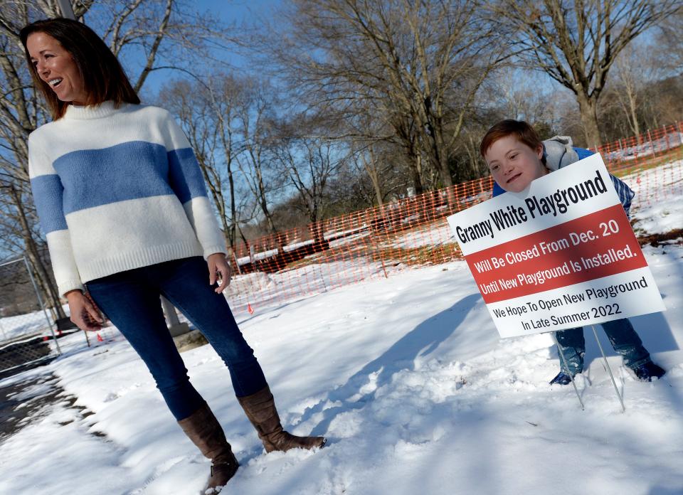 Kara Peck and her son Miles stand where a playground will be built at Granny White Park on Tuesday, Jan. 18, 2022, in Brentwood, Tenn. The Pecks' son Miles has Down syndrome. The couple is sponsoring the playground through their nonprofit, Miles 4 Miles.