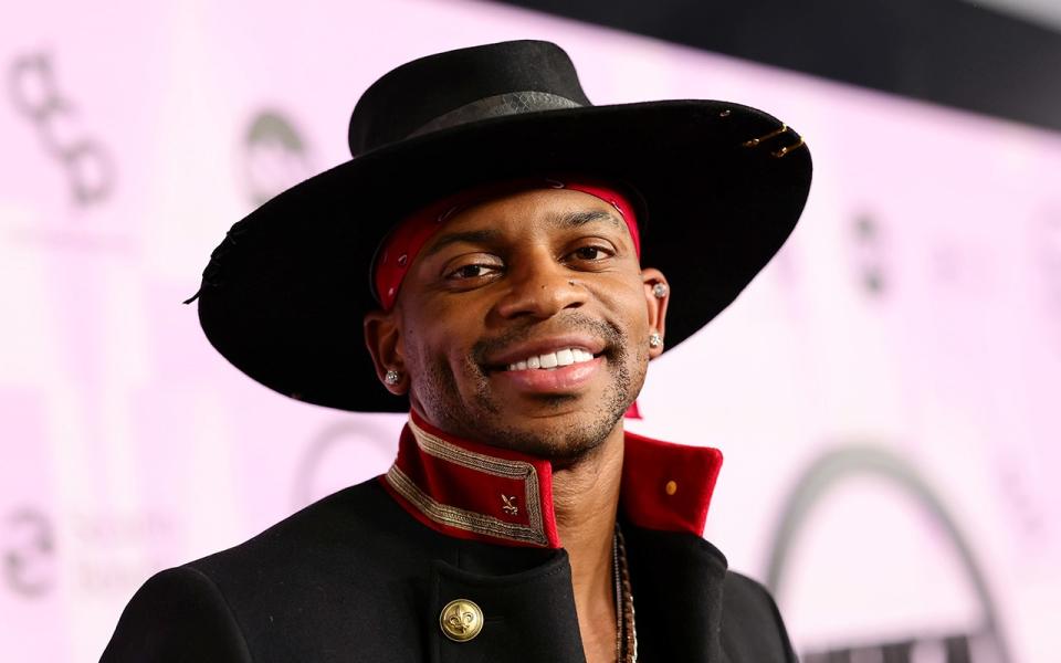 Jimmie Allen wearing a hat