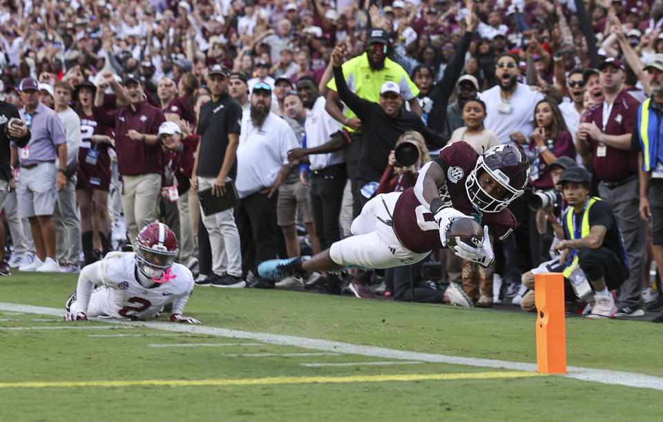 Oct 7, 2023; College Station, Texas; Texas A&M Aggies wide receiver Ainias Smith (0) dives for the end zone on a play during the fourth quarter against the Alabama Crimson Tide at Kyle Field. Troy Taormina-USA TODAY Sports