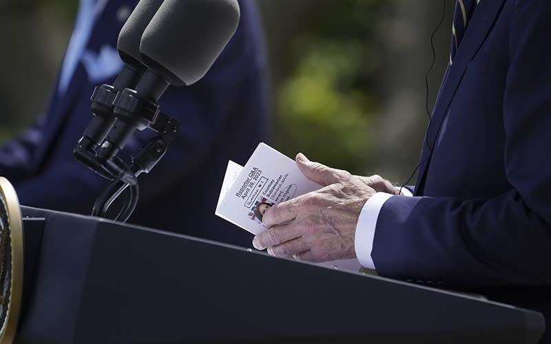 A close-up is seen of President Biden's hands holding notes during a news conference with South Korea's President Yoon Suk Yeol