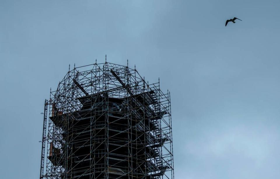 The Cape Hatteras Lighthouse is surrounded by scaffolding as it undergoes restoration on Monday, July 1, 2024. The project is expected to cost $19.2 million and will include replacing 40,000 of its estimated 1,250,000 bricks, replacing rusted or broken metal components and the installation of a near-exact replica of the first-order Fresnel lens.