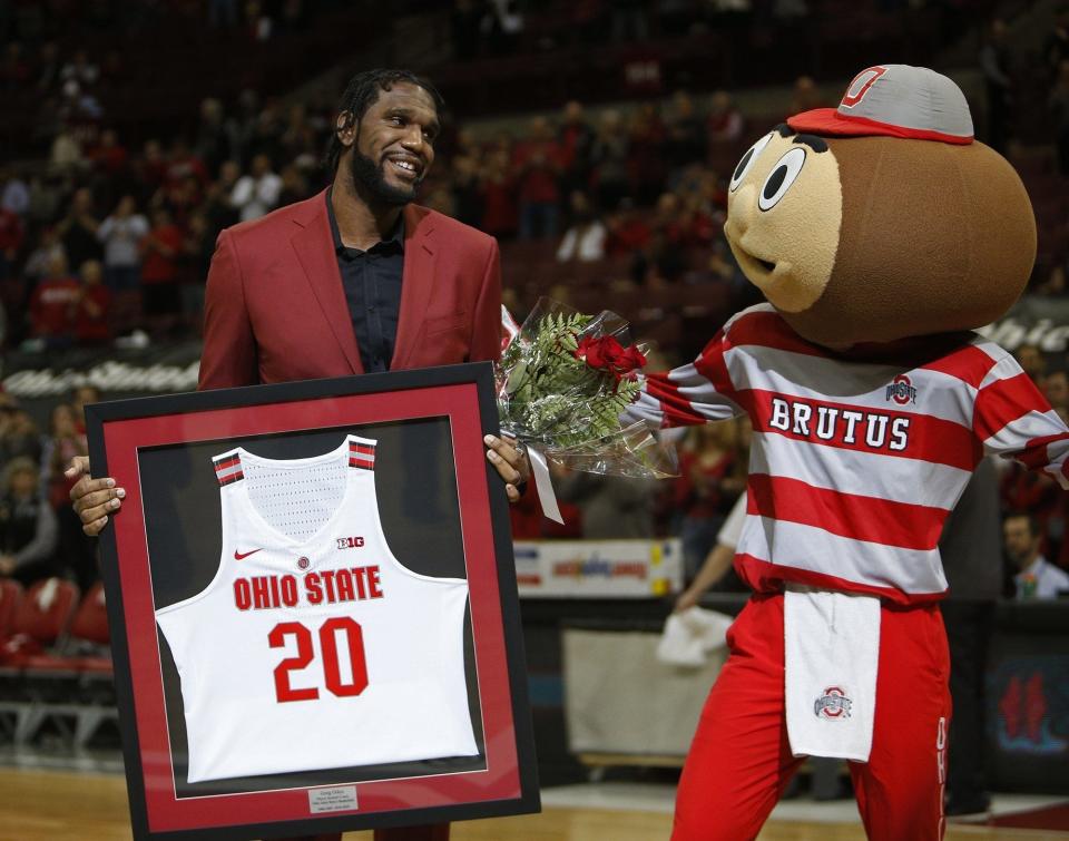 Former OSU basketball player Greg Oden celebrates senior day after graduating on March 10, 2019.