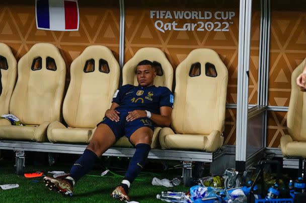 PHOTO: France's Kylian Mbappe sits on the bench after losing the World Cup final to Argentina, Dec. 18, 2022, in Lusail, Qatar. (AP Photo/Manu Fernandez)