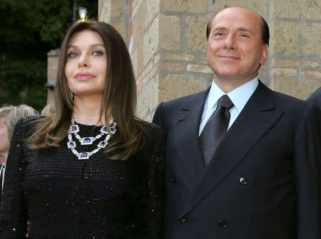 FILE PHOTO: Italy's Prime Minister Silvio Berlusconi and his wife Veronica Lario pose at Villa Madama in Rome, Italy June 4, 2004. REUTERS/Alessandro Bianchi/File Photo