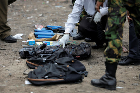 Backpacks, explosive materials and other items are seen at the site of an overnight gun battle, between troops and suspected Islamist militants, on the east coast of Sri Lanka, in Kalmunai, April 27, 2019. REUTERS/Dinuka Liyanawatte