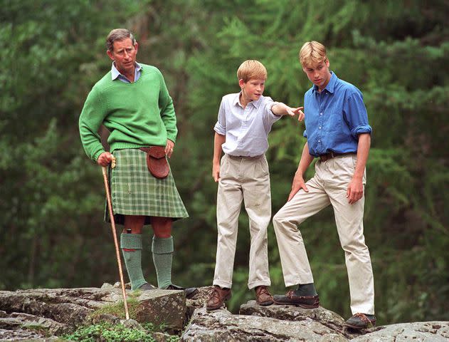 <p>Tim Graham Photo Library via Getty</p> Then-Prince Charles, Prince William and Prince Harry at Balmoral in 1997.