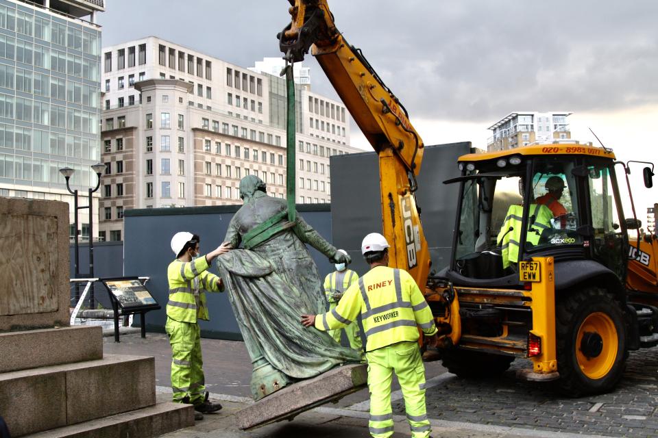 LONDON, ENGLAND - JUNE 09: Municipal workers remove the statue of slave-owner and slave merchant Robert Milligan after a petition in West India Quay district of London, United Kindgom on June 09, 2020. (Photo by Hasan Esen/Anadolu Agency via Getty Images)