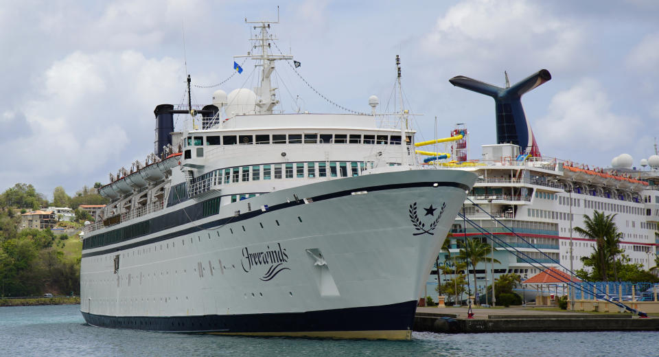 The Freewinds cruise ship is docked in the port of Castries, the capital of St. Lucia, Thursday, May 2, 2019. Authorities in the eastern Caribbean island have quarantined the ship after discovering a confirmed case of measles aboard. (AP Photo/Bradley Lacan)