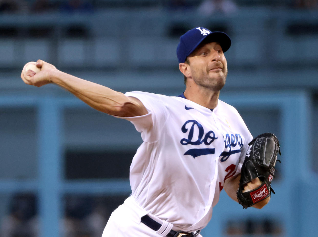 LOS ANGELES, CALIFORNIA - SEPTEMBER 01: Max Scherzer #31 of the Los Angeles Dodgers pitches against the Atlanta Braves during the first inning at Dodger Stadium on September 01, 2021 in Los Angeles, California. (Photo by Harry How/Getty Images)