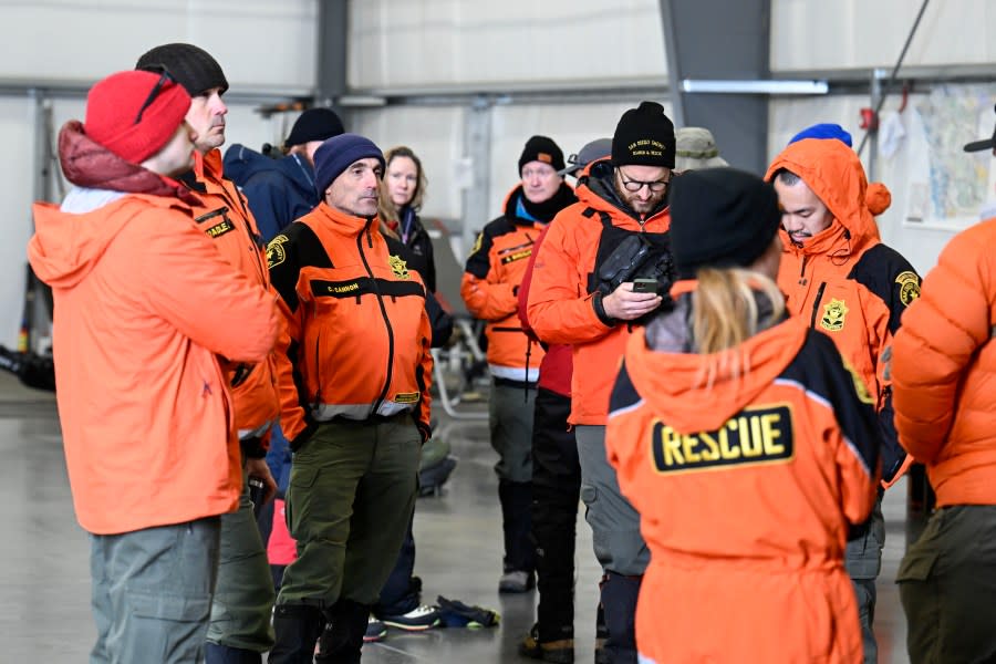 Rescue personnel meet at a command center, Wednesday, Feb. 7, 2024, in Kitchen Creek, Calif. A Marine Corps helicopter that had been missing with five troops aboard as an historic storm continued drenching California was found Wednesday morning in a mountainous area outside San Diego. (AP Photo/Denis Poroy)