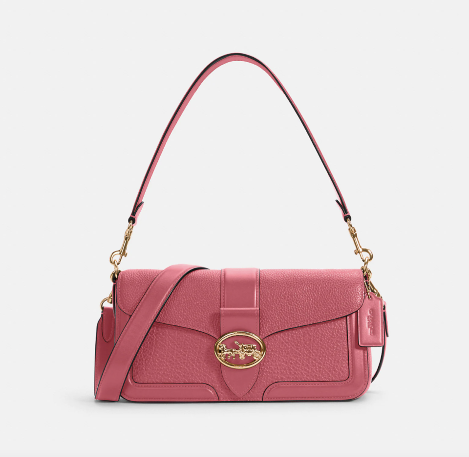 Georgie Shoulder Bag in pink leather with gold detailing (Photo via Coach Outlet)